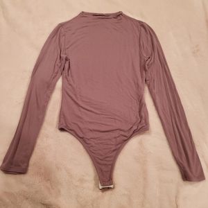 Naked Wardobe Long Sleeve Body Suit with snap closure. Mauve. Size M.